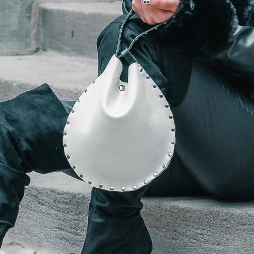 Rebellion Cream and Black leather wristlet with silver grommets